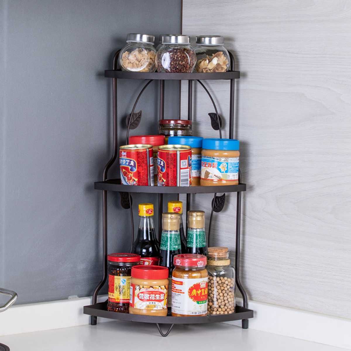 Space-Saving 3-Tier Kitchen Corner Rack by Metallics Home with jars and condiments organized on three shelves.