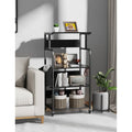 Federico Kitchen Moving Trolley Rack by Metallics Home features a sleek black design with multiple shelves, decorative items,