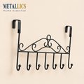 Over the Door Crown Hanger by Metallics Home features a decorative black metal design with six hooks for hanging items.