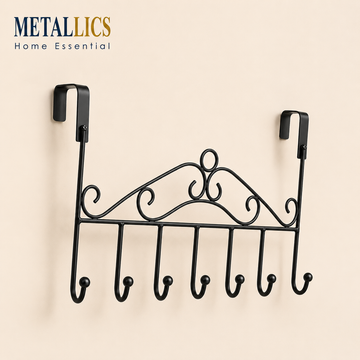 Over the Door Crown Hanger by Metallics Home features a decorative black metal design with six hooks for hanging items.