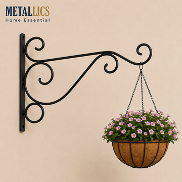 Wall Mounted Flower Pot Hanger Stand by Metallics Home features a black metal bracket with a decorative scroll design, holdin