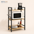 3-tier multipurpose storage rack with a microwave, coffee maker, utensils, and plates on wooden shelves and metal frame.