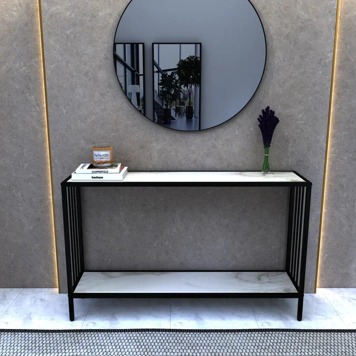 Decigi Entryway Console Table by Metallics Home features a sleek black frame with a marble top, styled against a modern backd