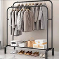 Metal Clothes Stand by Metallics Home featuring hanging space for coats, side shelves, hooks, and shoes below.