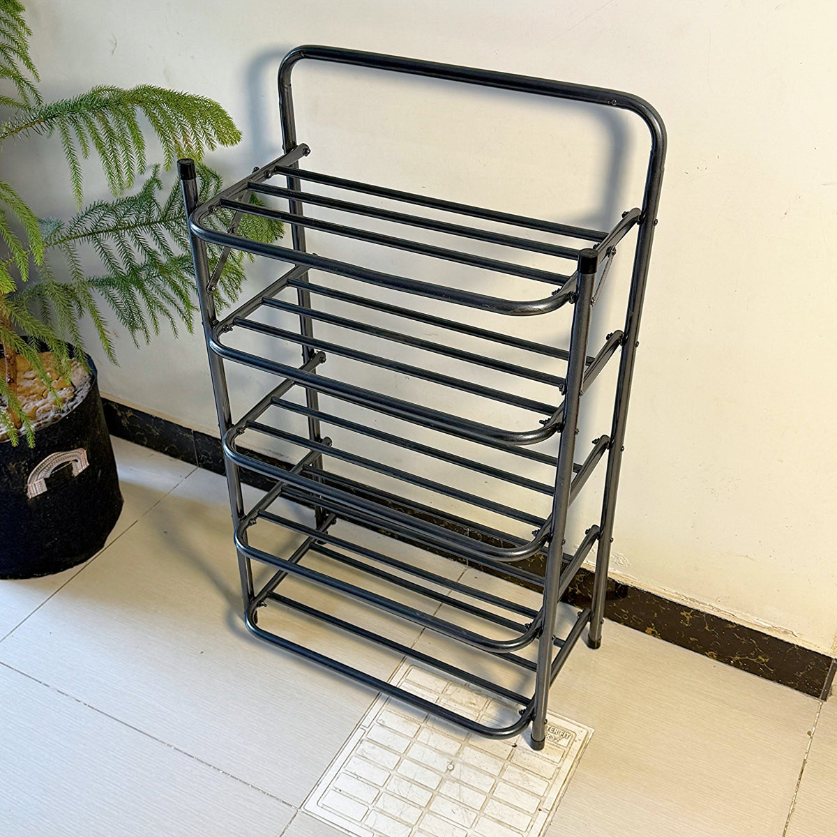 Foldable Metal Shoes Rack by Metallics Home features a sleek black design with five tiers for organized shoe storage.