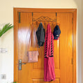 Set of 3 Over the Door Hangers by Metallics Home displayed on a wooden door, holding clothing items and accessories.