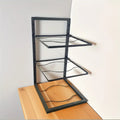 Floor Standing Kitchen Shelf by Metallics Home features a sleek metal frame with three open shelves, ideal for storage.