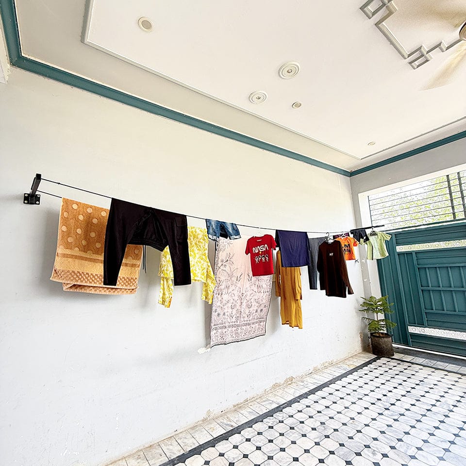Cloth Drying Stand with Free Rope, foldable and wall-mounted, displaying various clothes and towels hanging for drying.