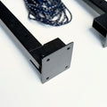 Foldable wall-mounted cloth drying stand with black metallic finish and free rope for easy installation.
