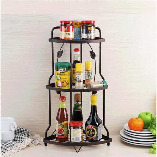 Space-Saving 3-Tier Kitchen Corner Rack by Metallics Home, featuring three shelves holding various bottles and jars.