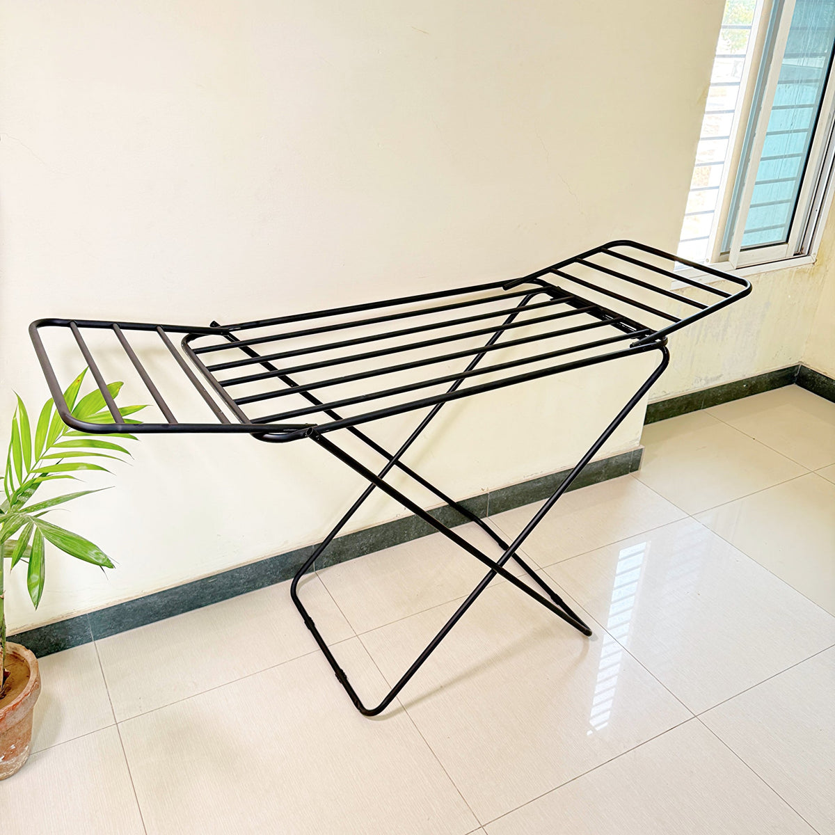 Premium Metal Folding Cloth Dryer Stand by Metallics Home features a sleek black design with cross legs for stability, ideal 