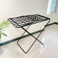 Premium Metal Folding Cloth Dryer Stand by Metallics Home features a sturdy black metal frame with a grid design, ideal for d