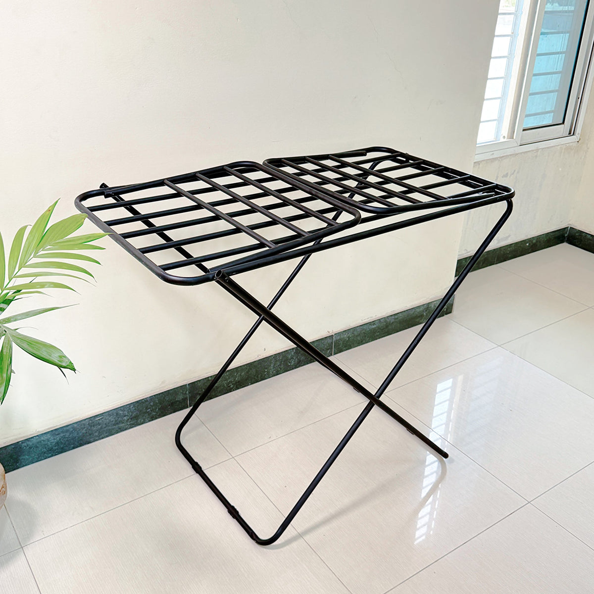 Premium Metal Folding Cloth Dryer Stand by Metallics Home features a sturdy black metal frame with a grid design, ideal for d